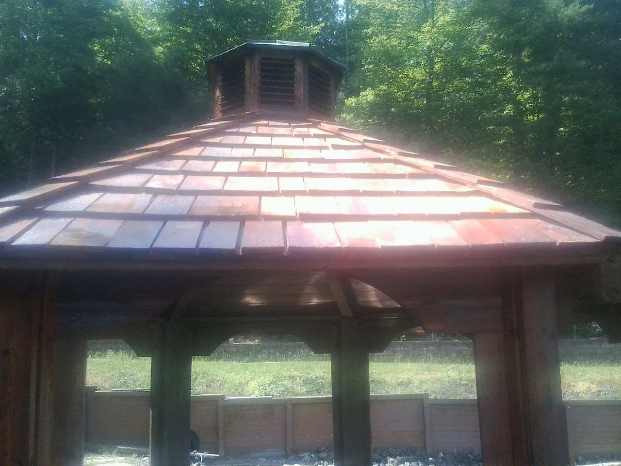 New cedar shake roof and cupola on a lakeside gazebo in Bristol